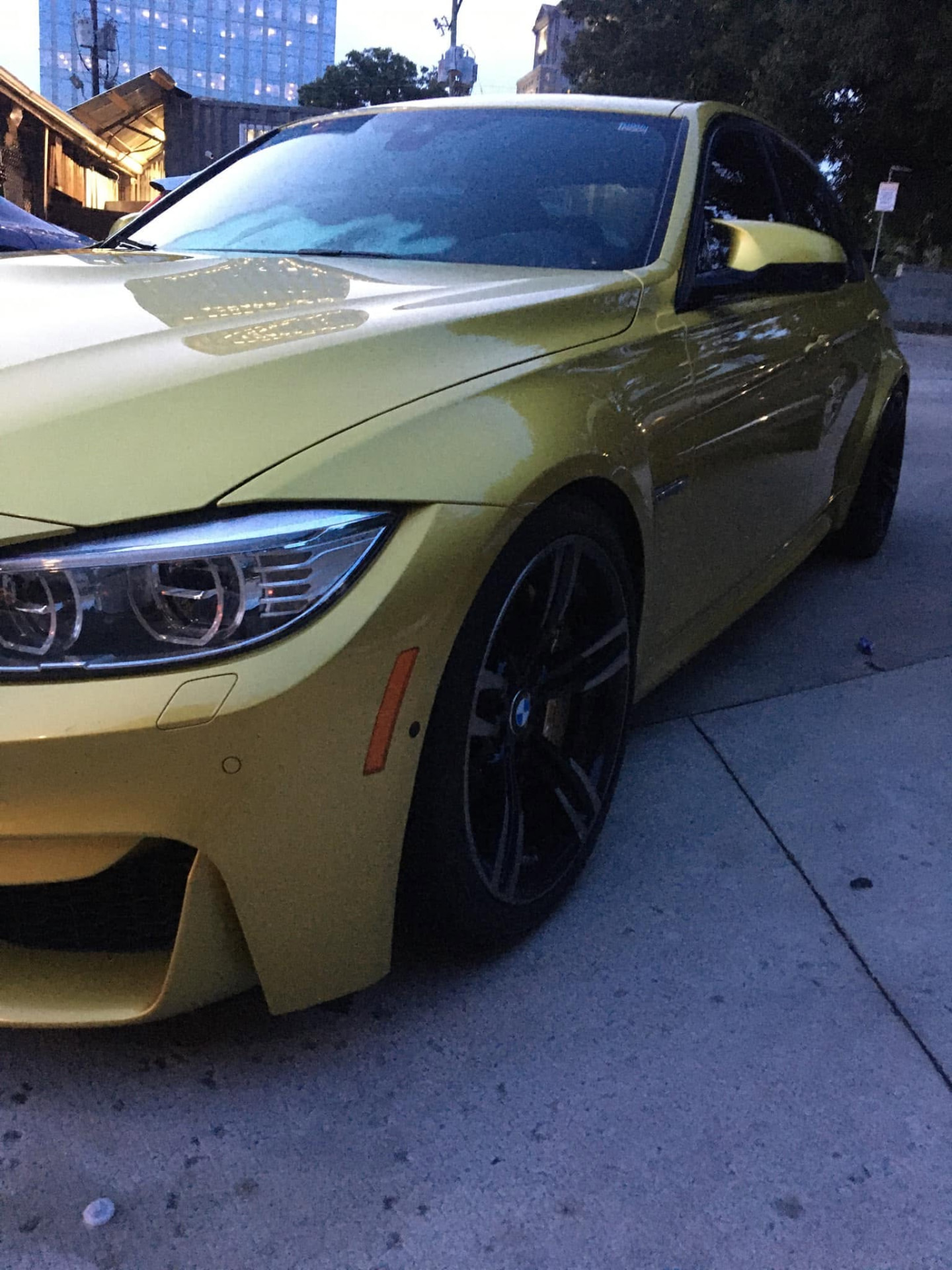 Yellow performance sedan after a full exterior detail