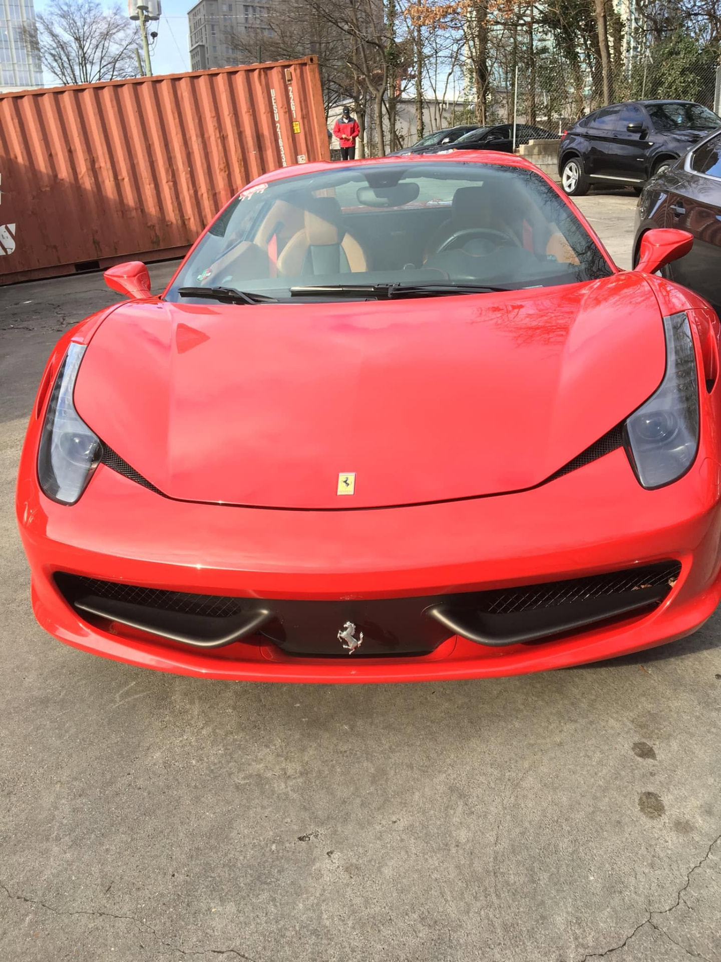 Red exotic sports car detailed to a show-car finish