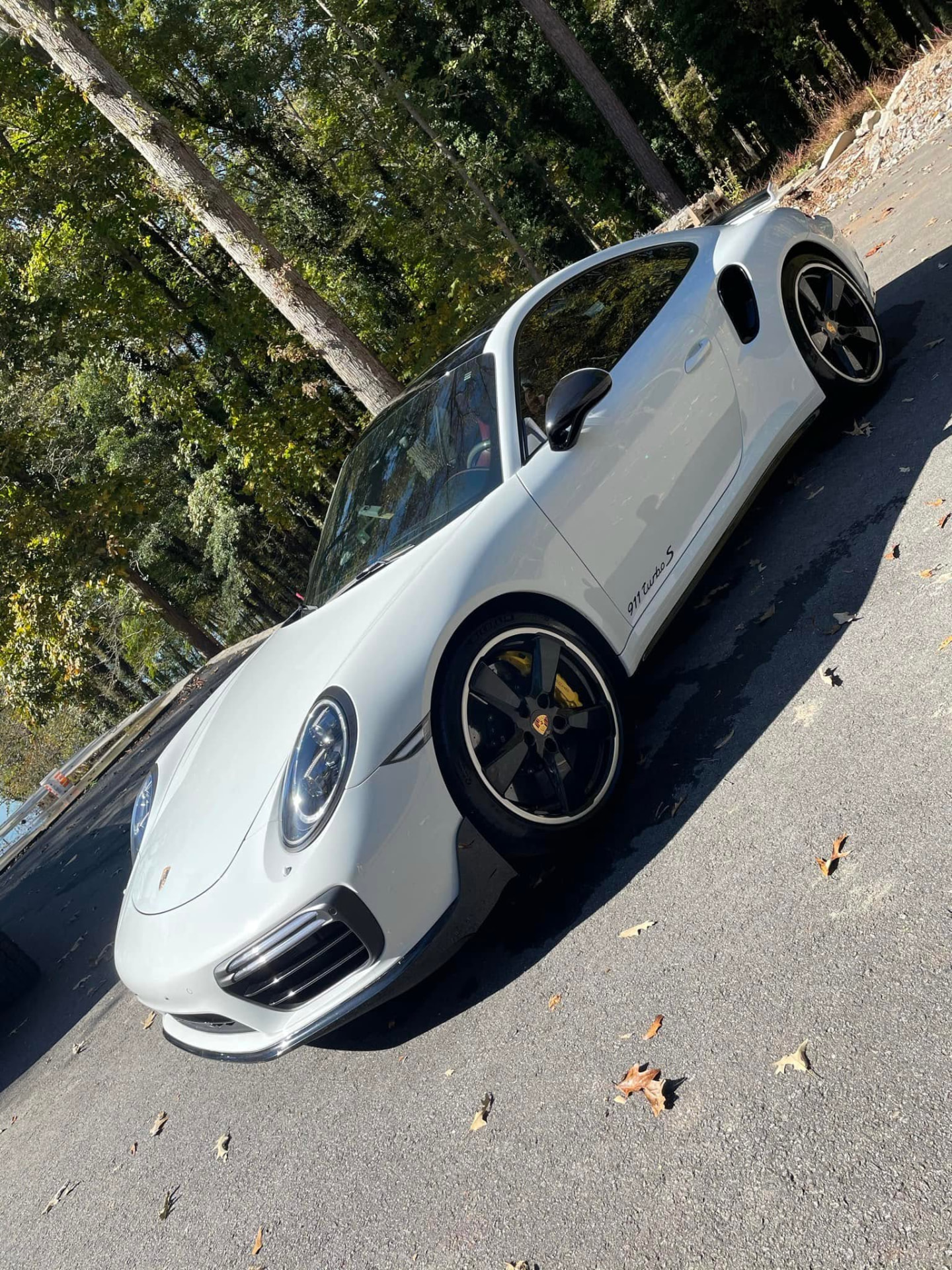White sports car detailed with spotless paint and wheels